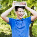 smiling-teen-boy-with-books